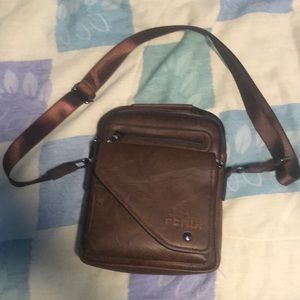 Brown FENDI man bag.